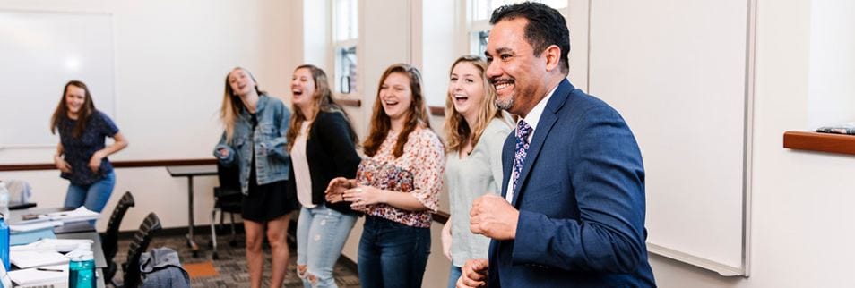 anthony rodriguez in harkins hall classroom with students